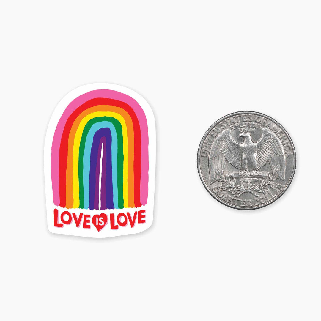 A cell phone sticker slightly larger than the size of a quarter that says love is love with a simple painting of a rainbow above those words.